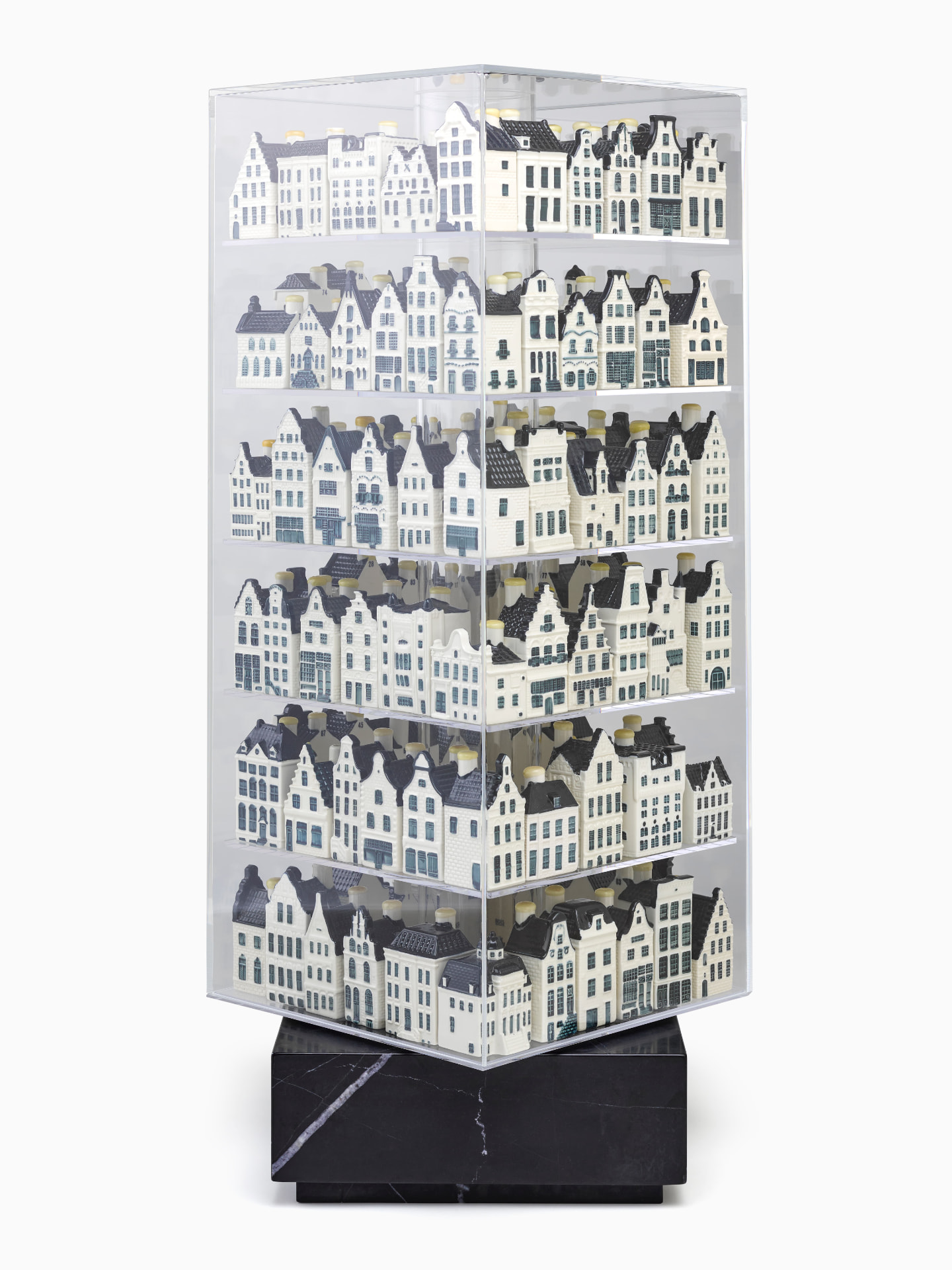 Display case filled with KLM Delft Blue houses, corner view