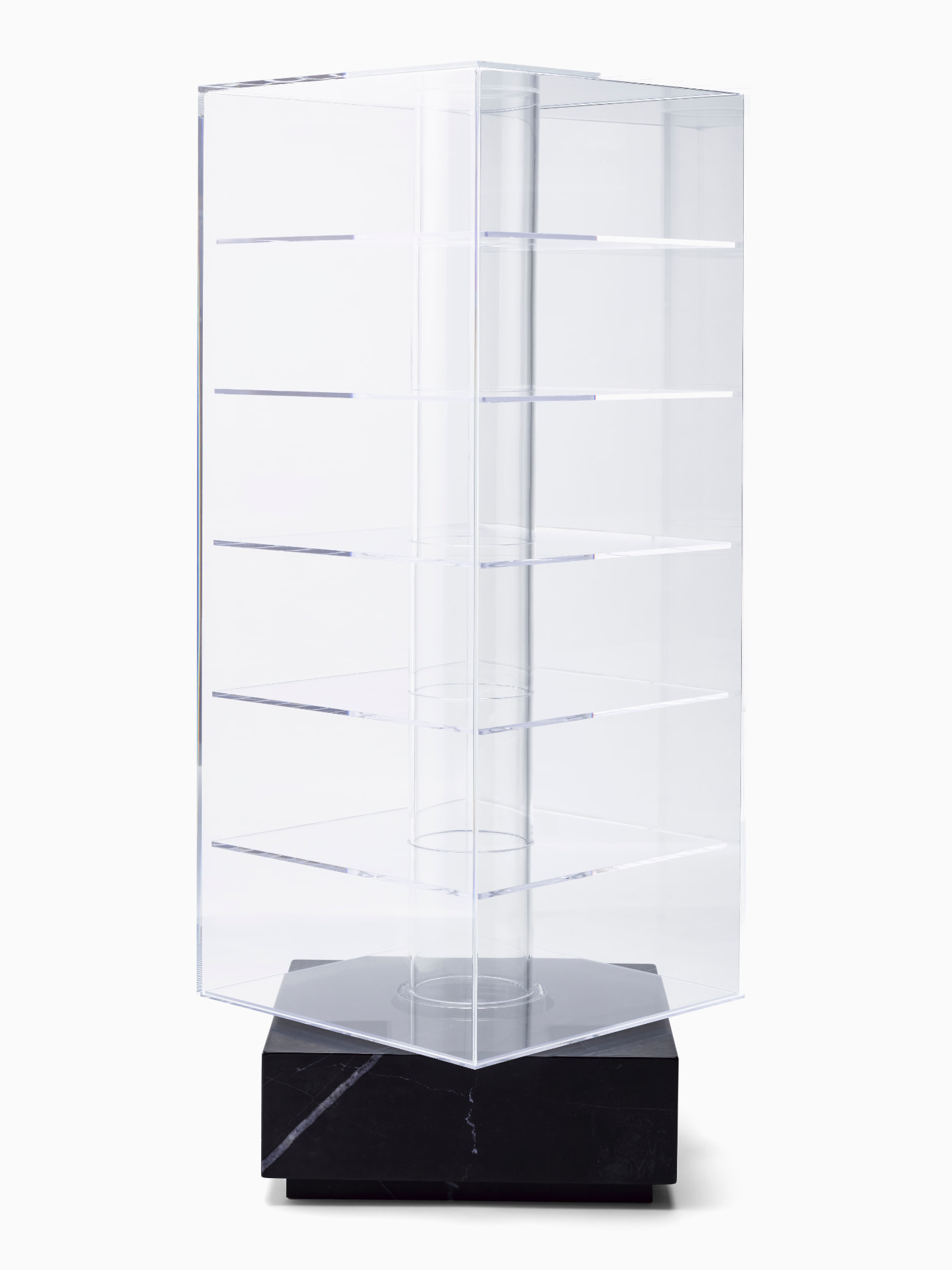 Empty acrylic display case on black marble base